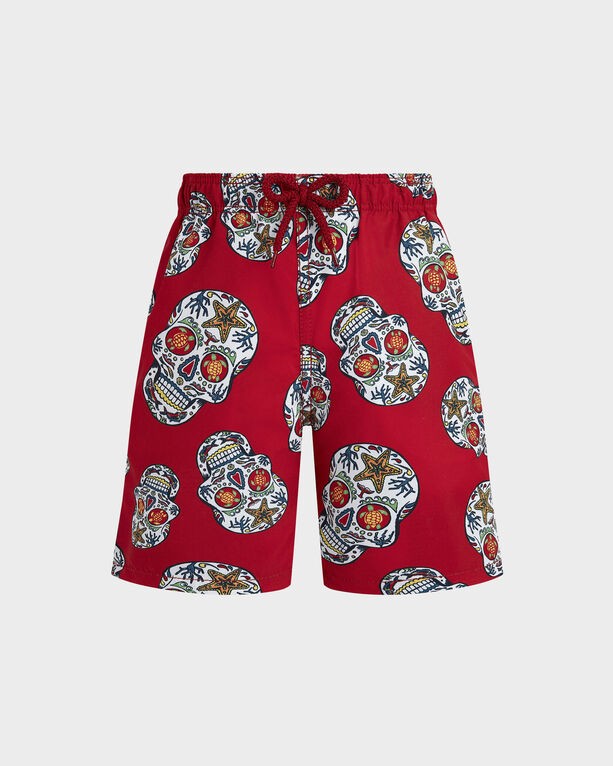 Red swim shorts featuring a Día De Muertos skull print, with colorful details, an elastic waistband, and a drawstring, made from lightweight material, size 2.