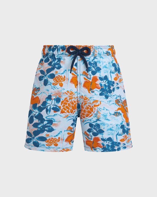 Boys' blue swim shorts featuring a vibrant jungle turtle and floral print in orange and blue, with an elastic waistband and drawstring for adjustable fit.