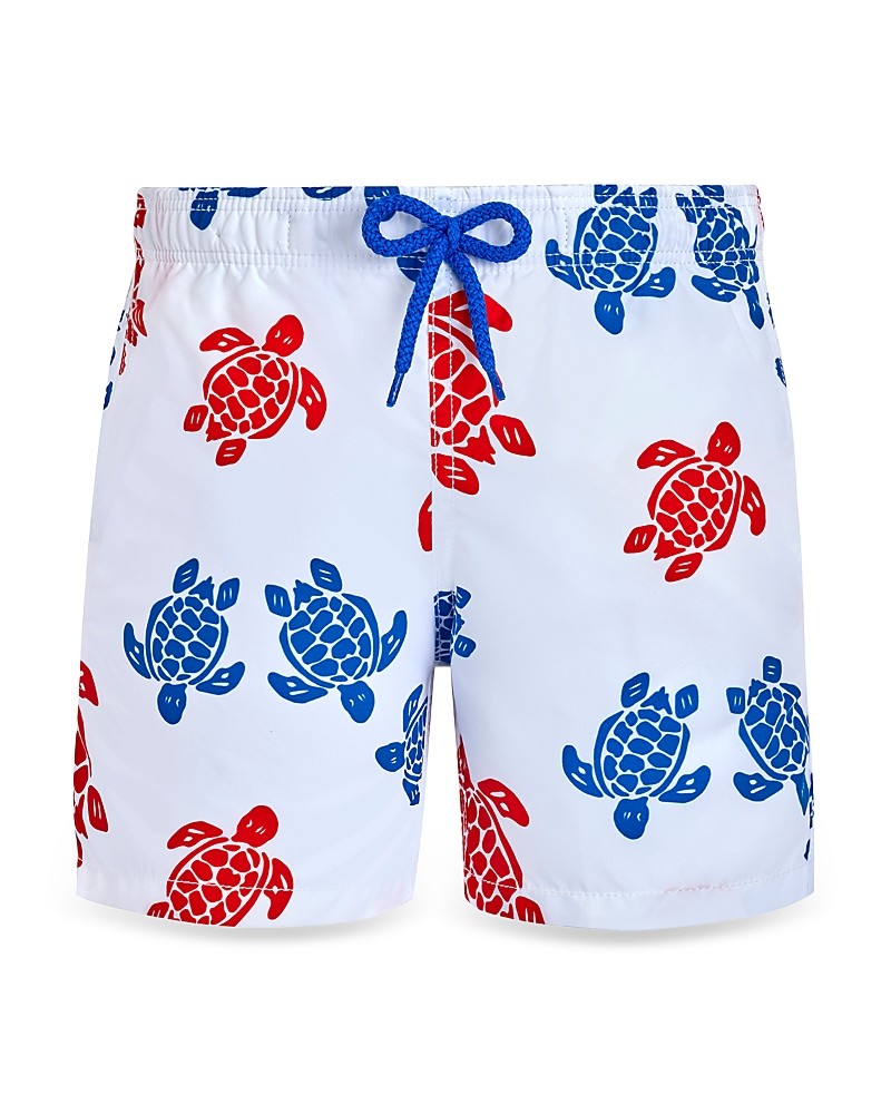 White swim trunks featuring a vibrant multi-color turtle print in red and blue, with a blue drawstring and a lightweight, quick-drying material.