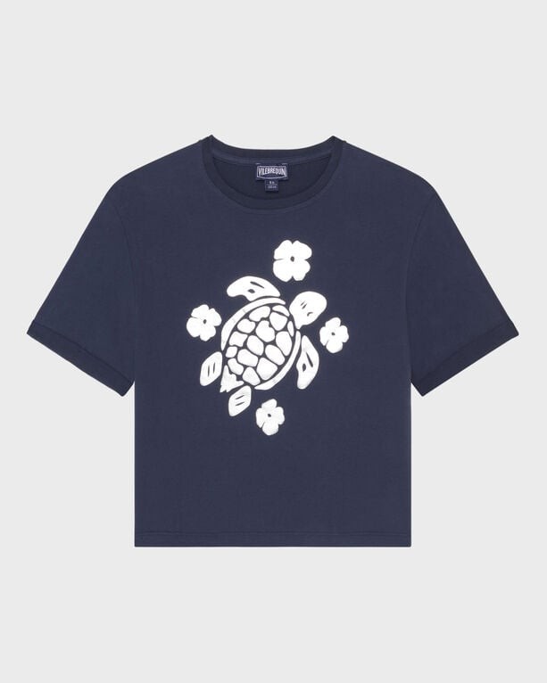 Cropped blue t-shirt for girls featuring a shiny white turtle graphic surrounded by flowers, made from soft material, available in size 4.