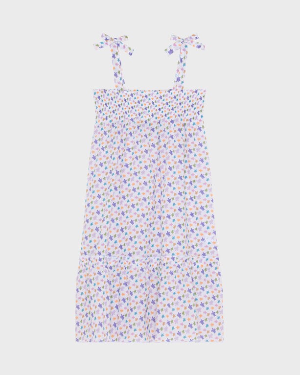 White organic cotton voile dress featuring a floral pattern in purple, pink, and blue, with adjustable tie straps and a tiered hem, designed for girls in size 8.