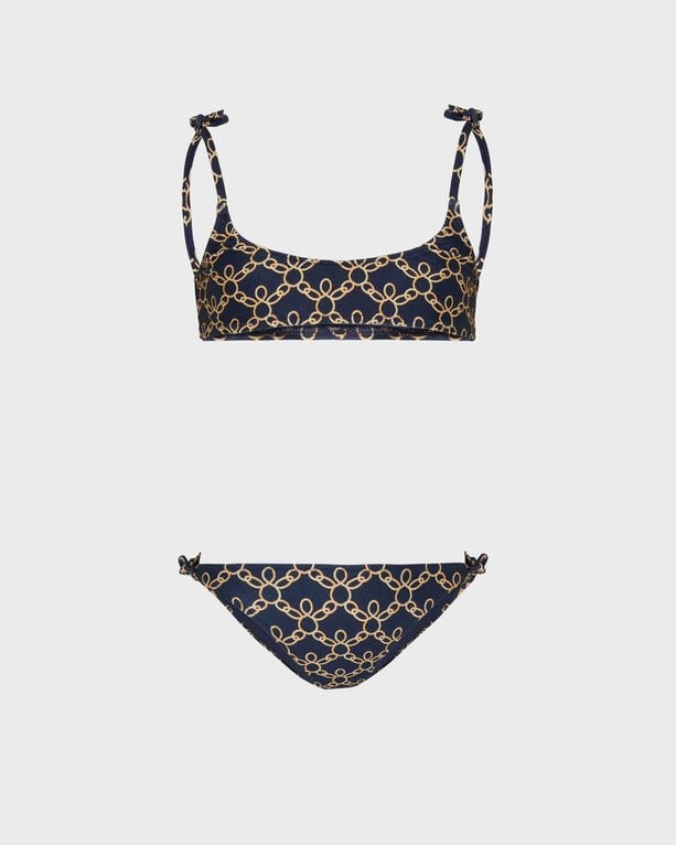 Blue two-piece swimsuit featuring a turtle chain pattern, with adjustable straps on the top and decorative ties on the bikini bottoms, made from soft swimwear material, size 4.