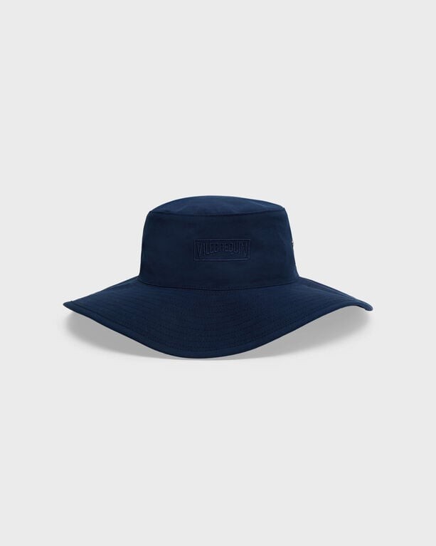 Solid blue large bucket hat by Vilebrequin, featuring a wide brim and embossed logo on the front, made from lightweight material, suitable for various outdoor activities.