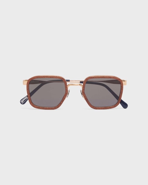 Mahoganywood sunglasses in a pink and brown color scheme with an octagonal frame, featuring dark lenses and gold accents, designed by Vilebrequin.