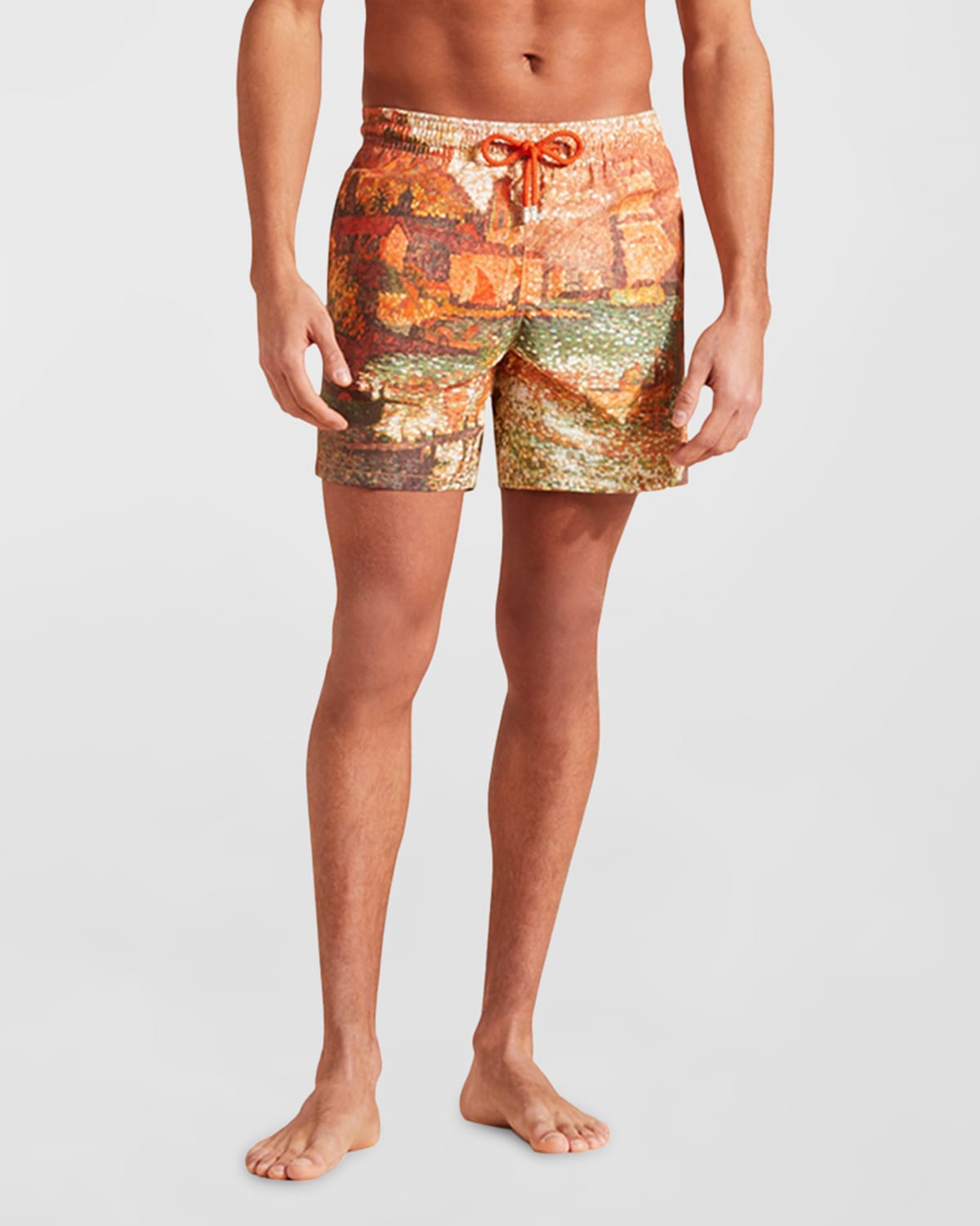 Red swim shorts featuring a vibrant print inspired by Paul Signac, with an elastic waistband and drawstring, made from lightweight material, shown on a model.