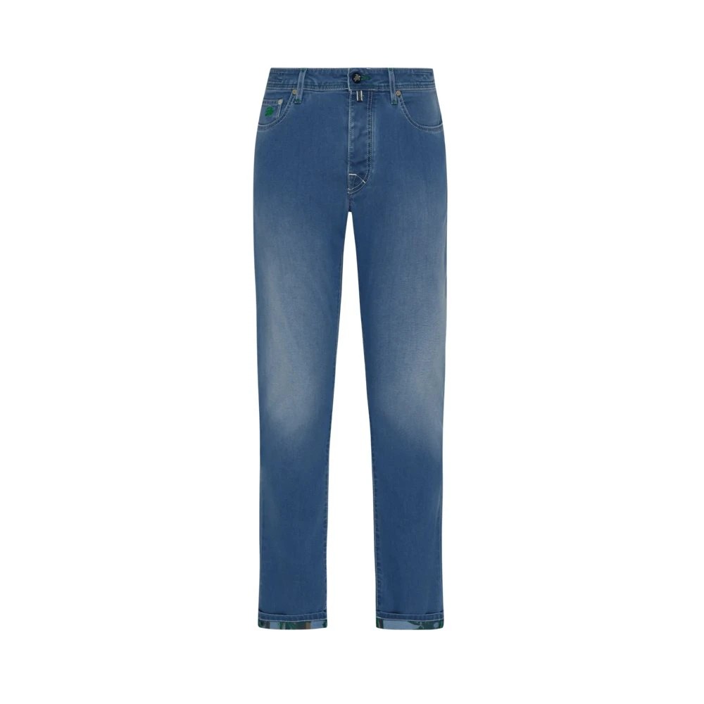 Blue denim pants with a five-pocket design, featuring a slightly faded finish and colorful palm print accents on the cuffs, in size 32 by Vilebrequin.
