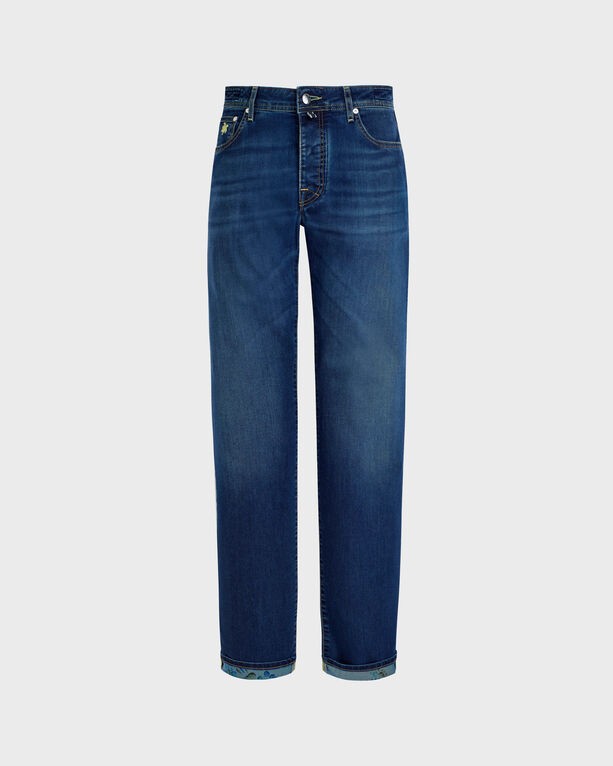 Blue denim pants with five pockets, featuring a straight leg cut, subtle turtle embroidery, and a classic button and zipper closure, in size 35.