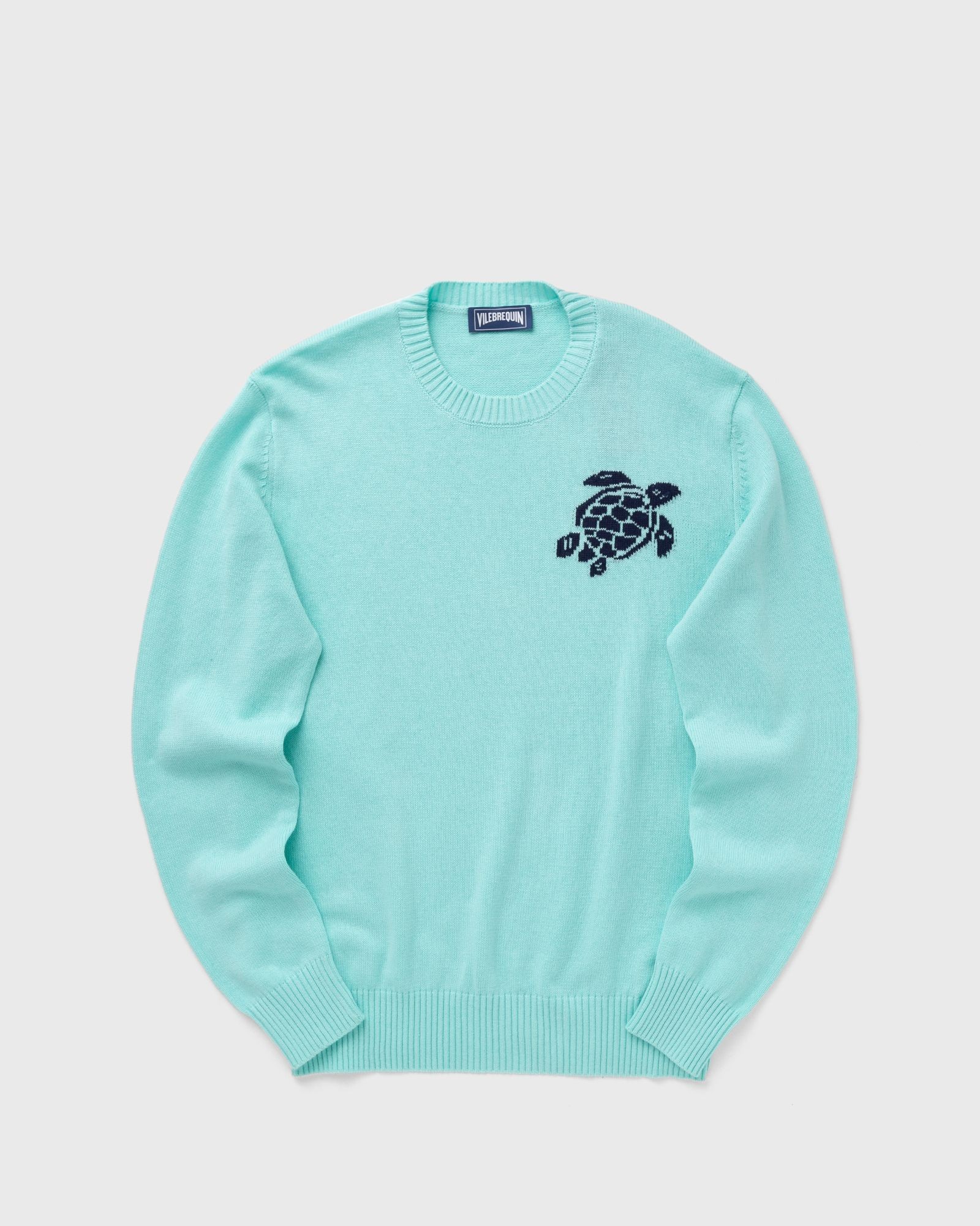 Light blue crewneck sweater made of cotton and cashmere, featuring a navy turtle emblem on the chest and ribbed cuffs and hem, in size M.