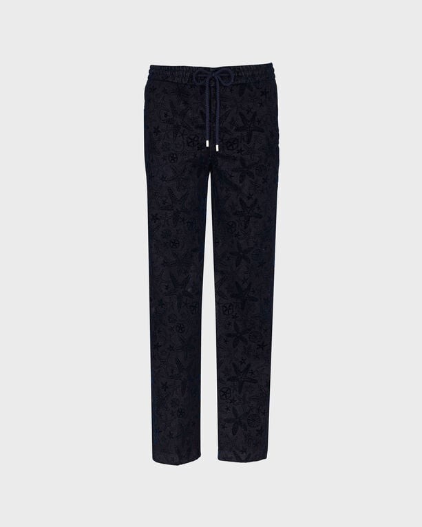 Blue denim jogger pants by Vilebrequin, featuring a flocked starlette pattern, elastic waistband with drawstring, and a relaxed fit, available in size 28.