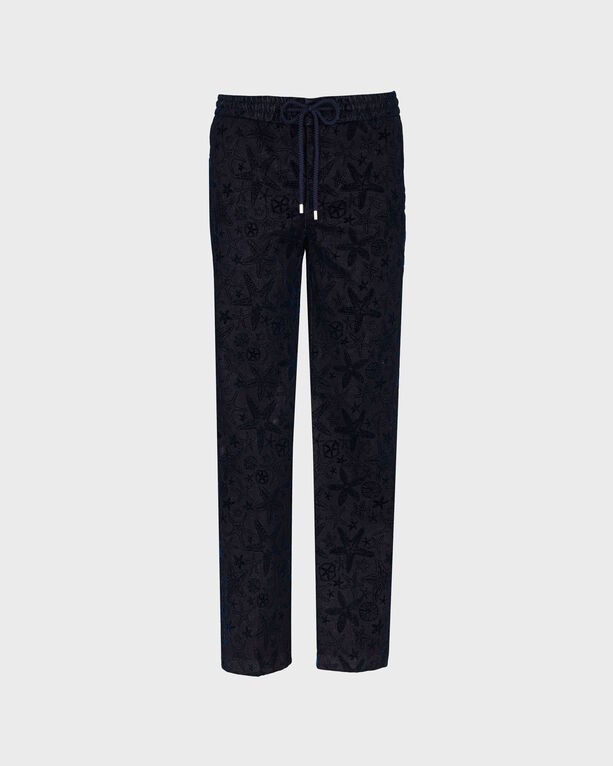 Blue denim jogger pants by Vilebrequin featuring a flocked starlette pattern, elastic waistband with drawstring, and a relaxed fit, available in size 29.