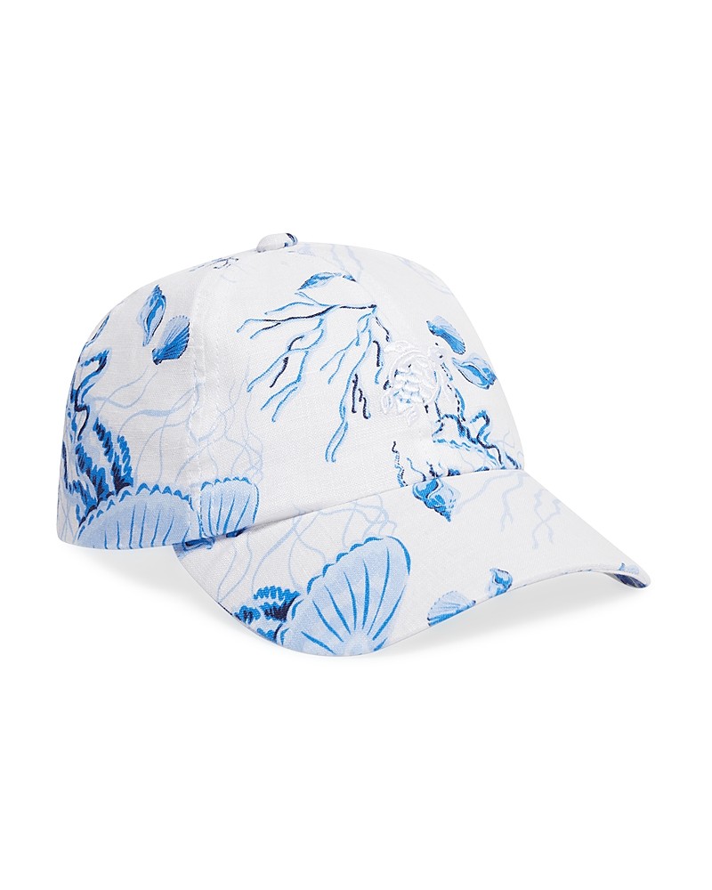 White linen cap featuring a vibrant blue Medusa and shell design, with a curved brim and adjustable strap at the back.