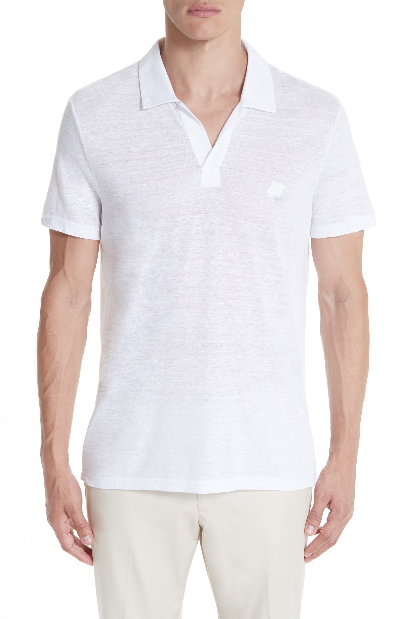 White linen polo shirt with a regular fit, short sleeves, and a classic collar, featuring a subtle logo on the chest.