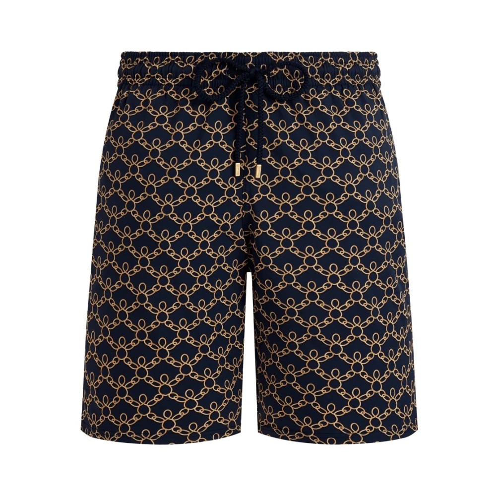 Blue long stretch swim shorts featuring a turtle chain pattern in gold, with an elastic waistband and drawstring for adjustable fit, made from lightweight swimwear material.