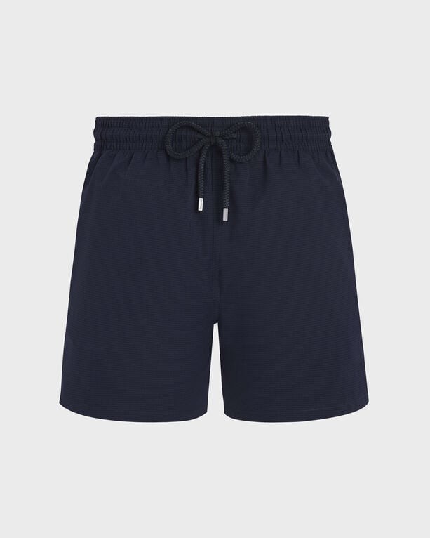 Blue micro-perforated swim shorts with an elastic waistband and drawstring, featuring a lightweight and packable design, labeled as size XXL by Vilebrequin.
