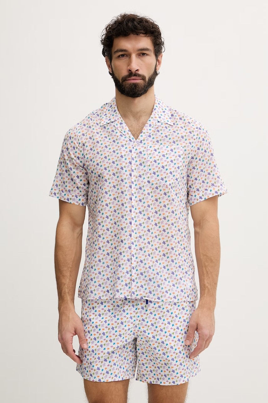 Short-sleeve cotton bowling shirt featuring a multicolor turtle print, lightweight fabric, and a relaxed fit, worn by a male model.