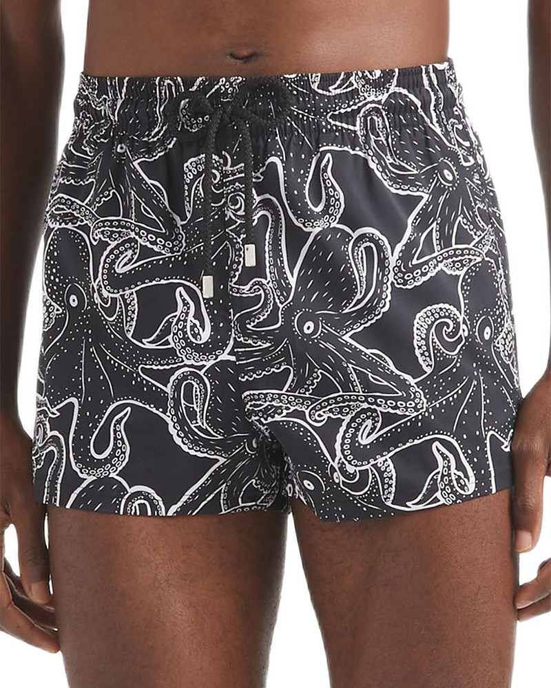 Black swim shorts featuring a white octopus print, made from lightweight material with an elastic waistband and drawstring, designed for men in size L.