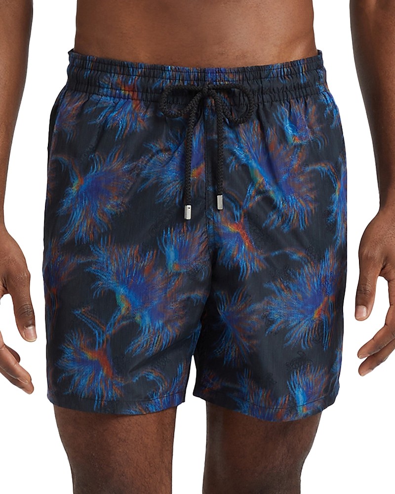 Black swim shorts featuring a vibrant blue and red palm tree print, made from lightweight material with an elastic waistband and drawstring.