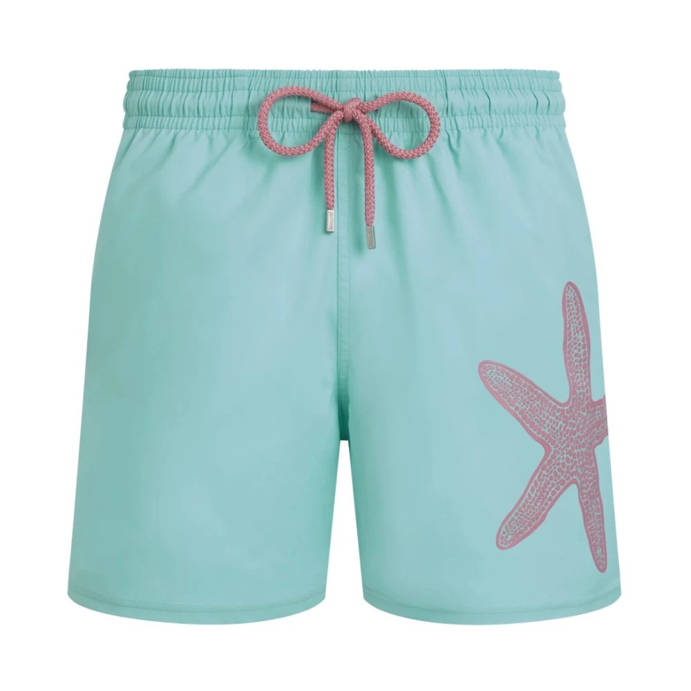 Light green stretch swim shorts featuring a large pink starfish design on the right side and a drawstring waistband, made from quick-drying material, size M.