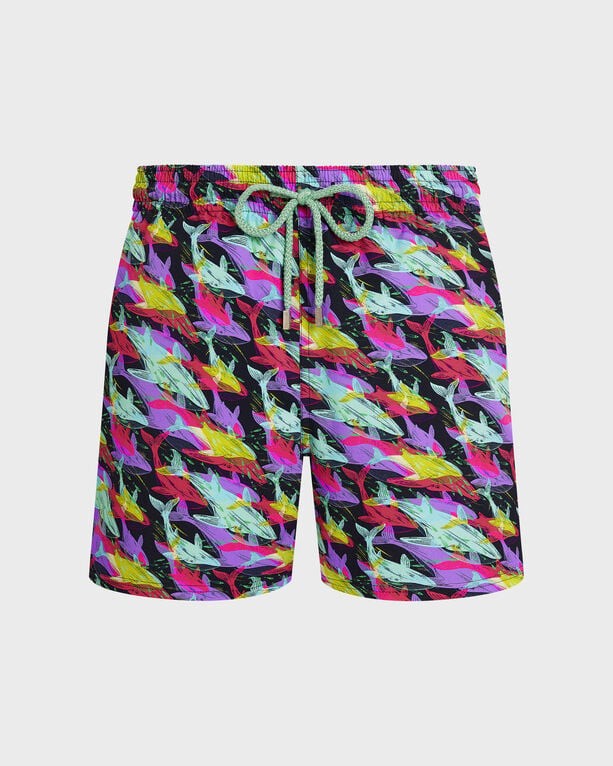 Blue swim shorts featuring a vibrant whale print in pink, green, and yellow, with an elastic waistband and drawstring for a comfortable fit, made from stretch material.