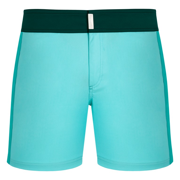 Men's Vilebrequin swim shorts in a vibrant blue color with a flat dark green belt, made from stretch material, featuring a color block design and a size S label.