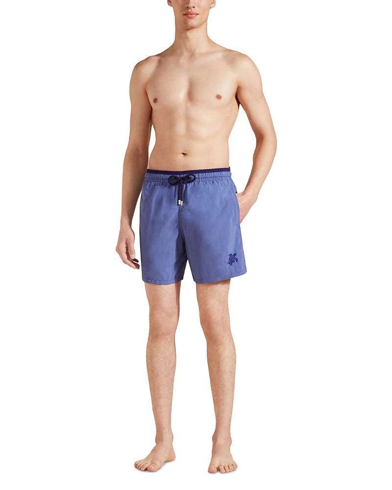 Bicolor men's swim shorts in moka and blue by Vilebrequin, featuring an elastic waistband with a drawstring and a logo on the left leg, made from lightweight material, size XL.