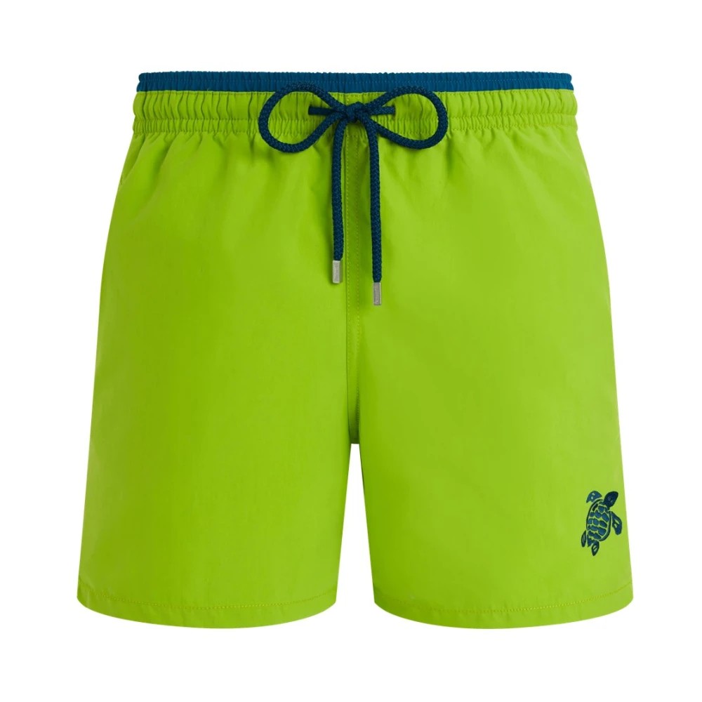 Bicolor men's swim shorts in vibrant green with a navy drawstring, featuring a turtle logo on the lower left leg, made from lightweight swimwear material, size M.