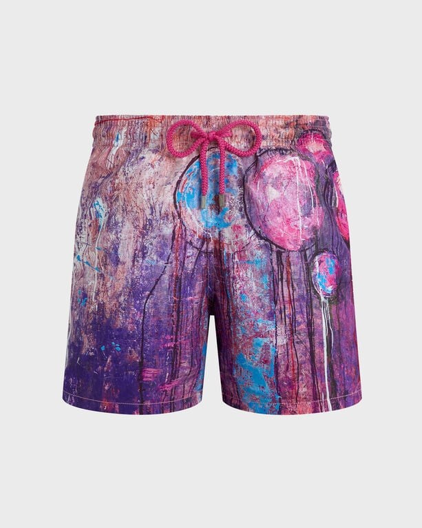 Purple swim shorts featuring a vibrant balloon print, with shades of pink and blue, elastic waistband, and drawstring detail, made from lightweight material.