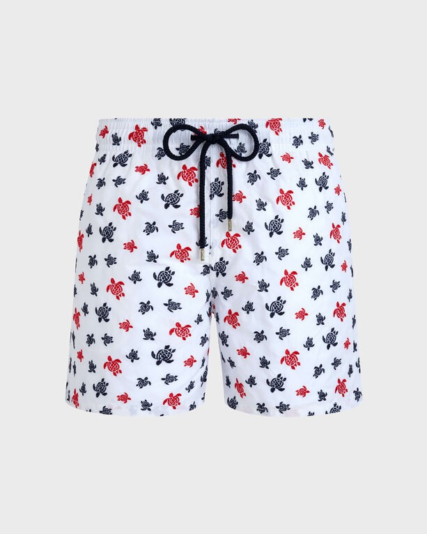 White swim shorts featuring an embroidered pattern of red and navy turtles, with a drawstring waist and a relaxed fit, in size XL by Vilebrequin.