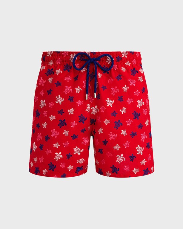 Red swim shorts featuring an embroidered turtle pattern in blue and white, with an elastic waistband and drawstring, made from lightweight fabric, size XXL.