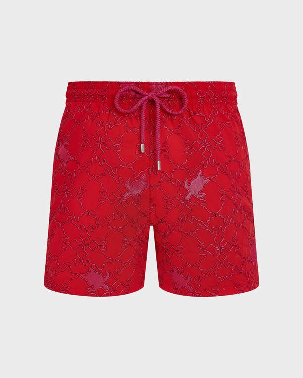 Red swim shorts featuring embroidered turtle designs, elastic waistband with drawstring, and a lightweight, quick-drying material, part of Vilebrequin's limited edition Mistral collection.