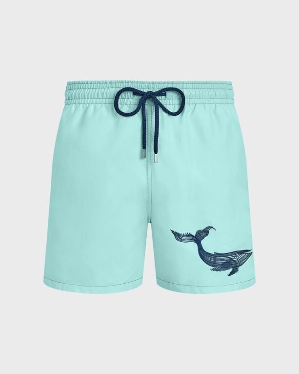 Light blue swim shorts featuring an embroidered whale design on the left side, with an elastic waistband and navy drawstring, made from quick-drying material, size XXXL.