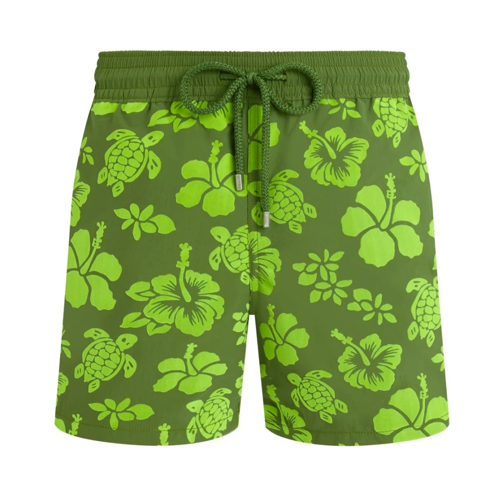 Green swim shorts featuring a flocked tropical turtle and floral pattern, with an elastic waistband and drawstring, made from lightweight material, size XL.