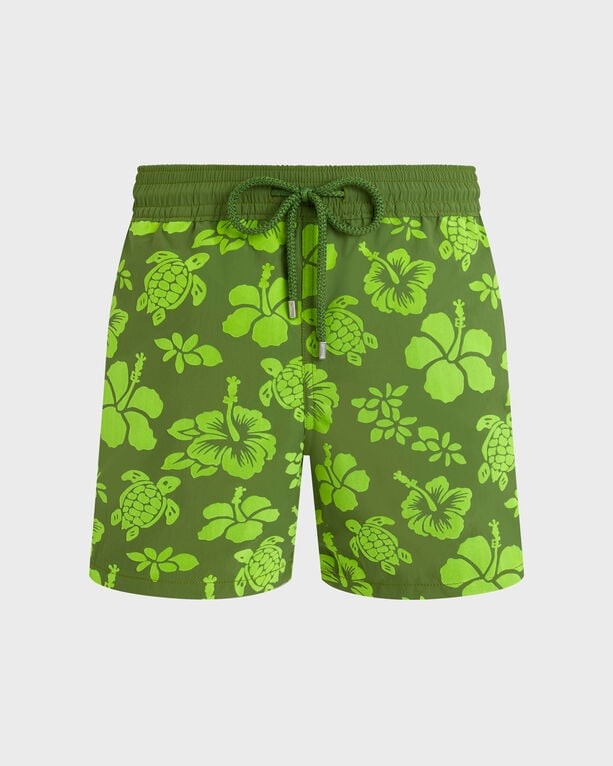 Green swim shorts featuring a flocked tropical turtle and floral pattern, with an elastic waistband and drawstring, designed for men in size XXXL.