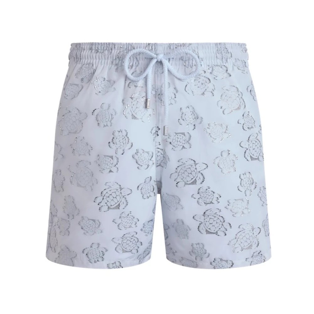White swim shorts featuring a jacquard pattern of turtles, with an elastic waistband and drawstring, designed by Vilebrequin in size S.