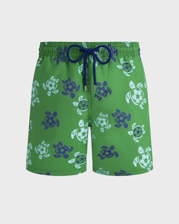 Green swim shorts featuring a playful soccer turtle pattern, with a drawstring waistband and a lightweight material, perfect for summer wear. Size S.
