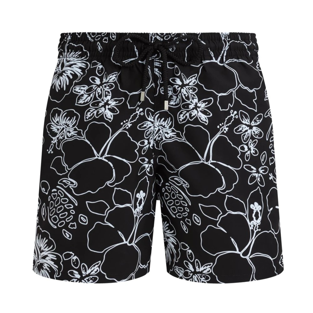 Black swim shorts featuring a tropical floral pattern in white, with an elastic waistband and drawstring, made from lightweight material, size L.
