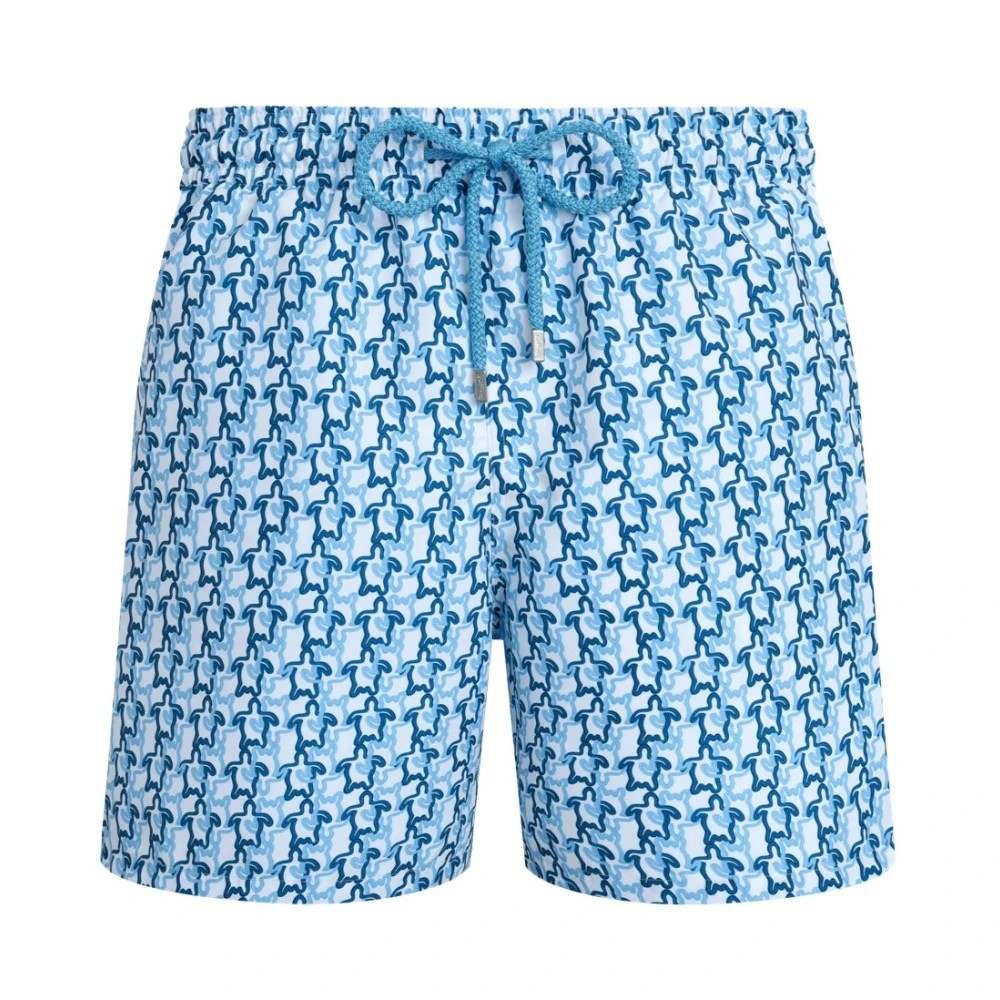 White swim shorts featuring a blue turtle pattern, made from lightweight material, with an elastic waistband and drawstring for adjustable fit, in size XXXL.
