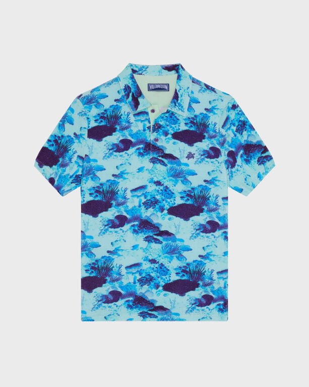 Men's blue terry polo shirt featuring a vibrant coral reef print with fish and marine life, short sleeves, and a classic collar, size M.