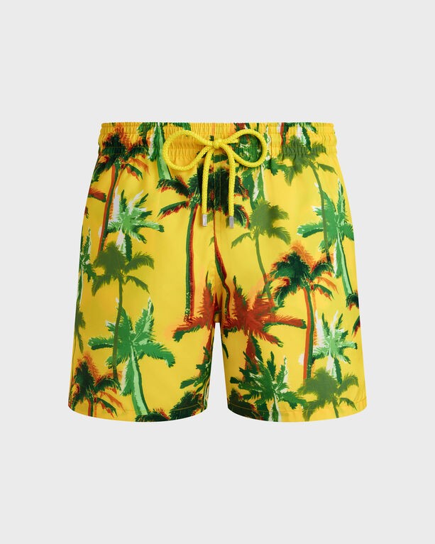 Yellow swim shorts featuring a vibrant palm tree print in green and red, with an elastic waistband and drawstring, made from ultra-light, packable material. Size XS.