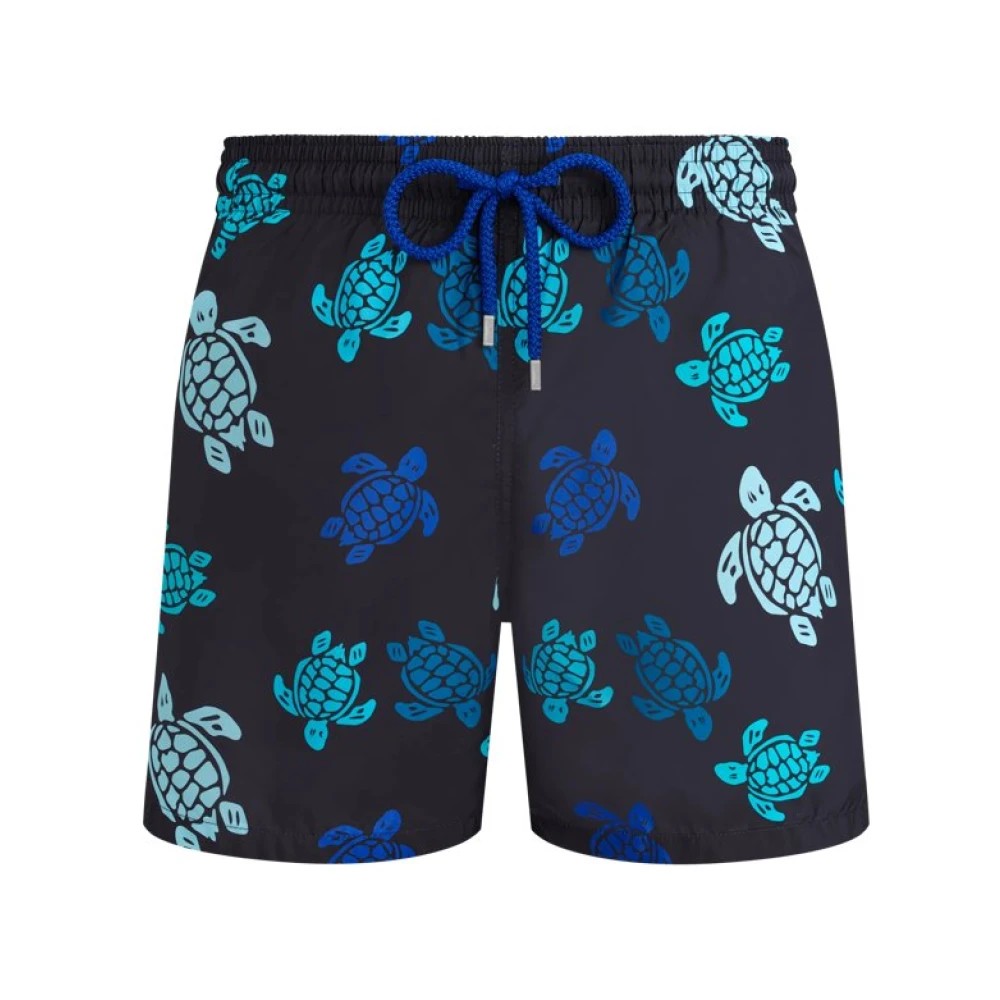 Black swim shorts featuring a vibrant multicolored turtle pattern, made from ultra-light, packable material, with a blue drawstring and a comfortable elastic waistband, size XXL.