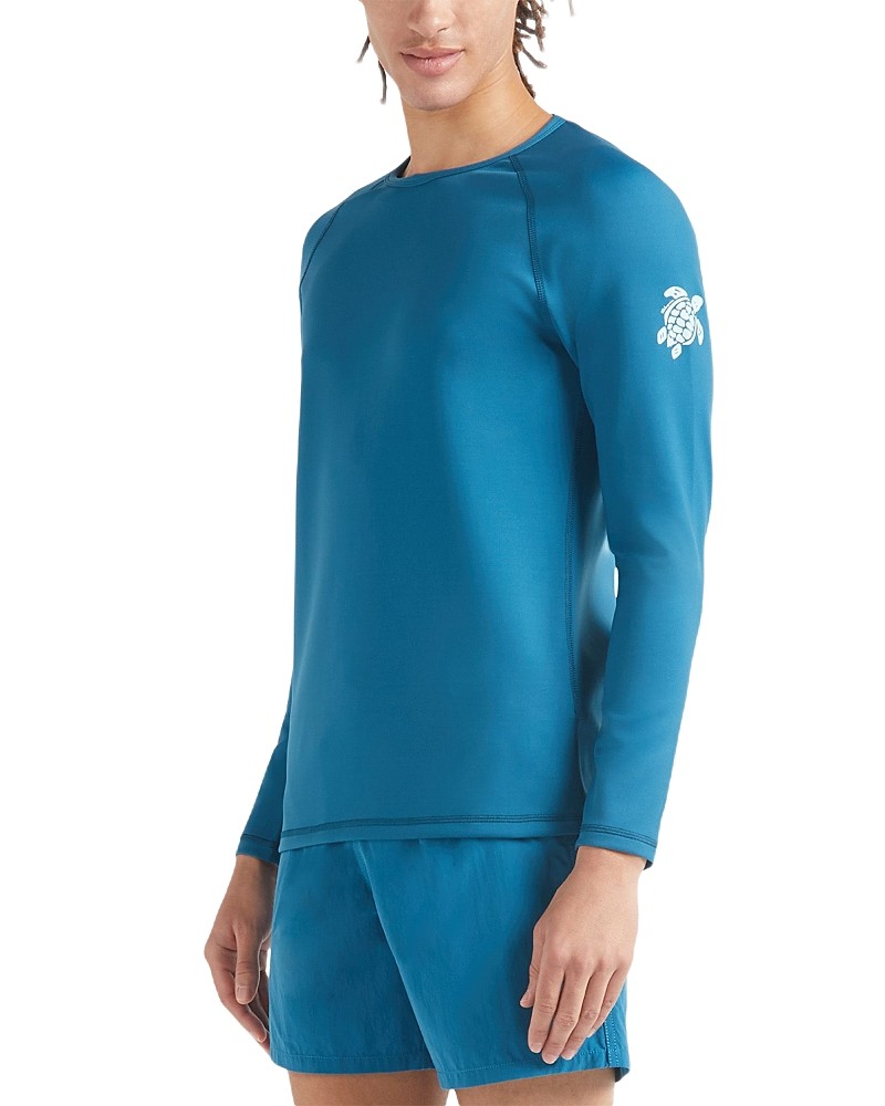 Blue long-sleeve rashguard made of UV-protective material, featuring a turtle logo on the left sleeve, designed for men in size S.
