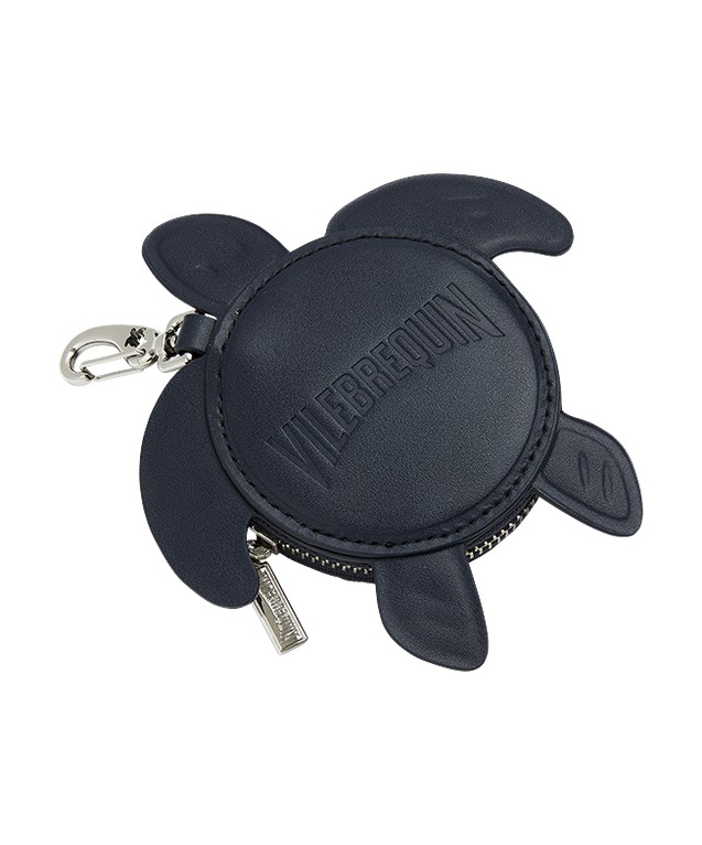 Navy blue turtle-shaped coin purse made of soft material, featuring embossed "Vilebrequin" logo and a silver zipper with a clip attachment.