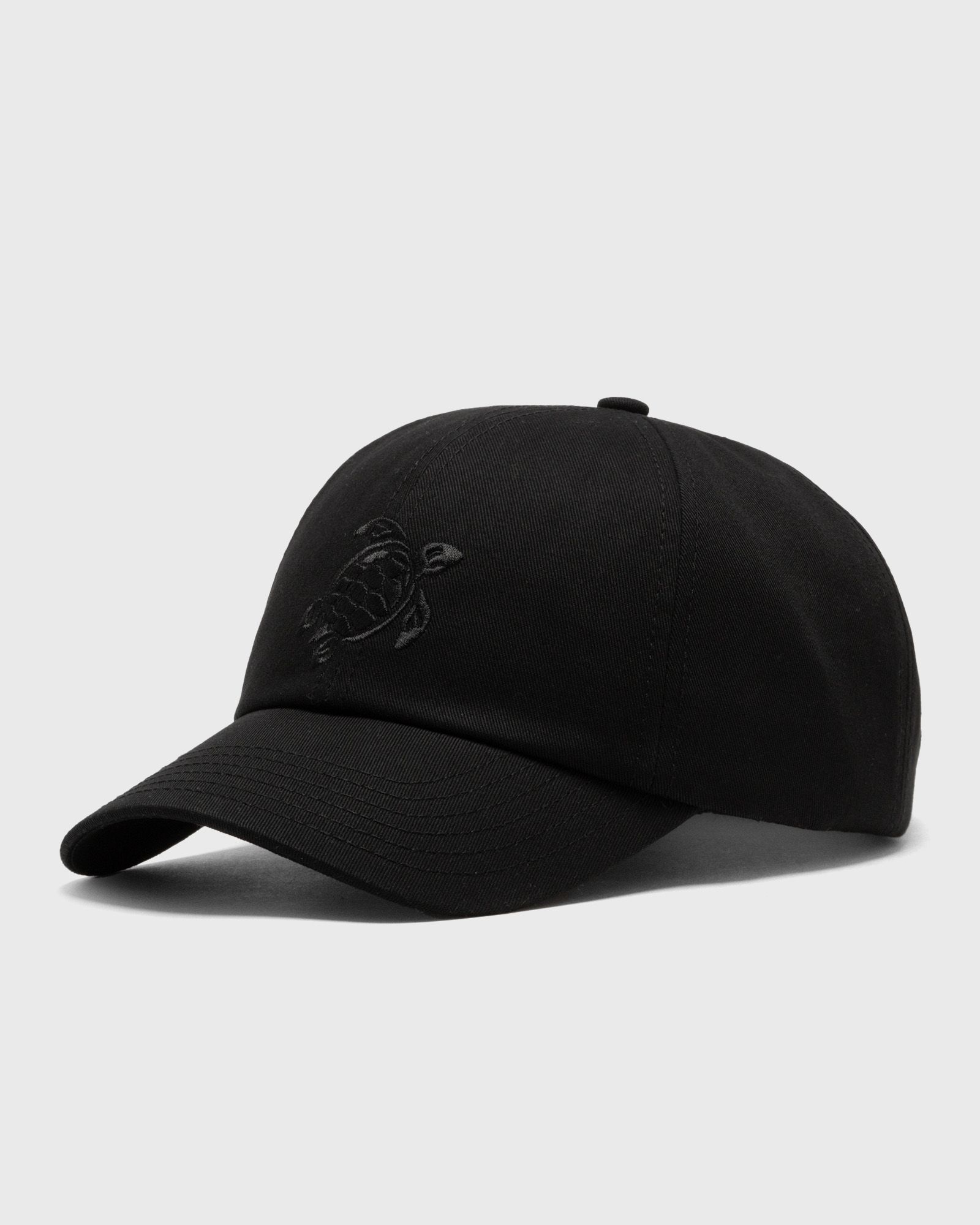 Black cotton cap featuring a subtle turtle embroidery on the front, with a curved brim and adjustable strap, designed for a comfortable fit.