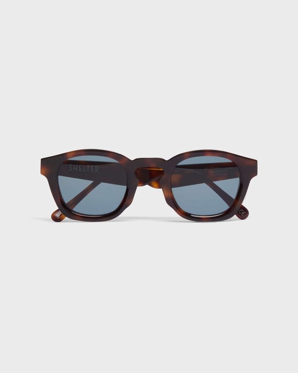 Unisex acetate cellulose sunglasses in a multi-toned tortoiseshell pattern, featuring round lenses and a stylish, contemporary design.