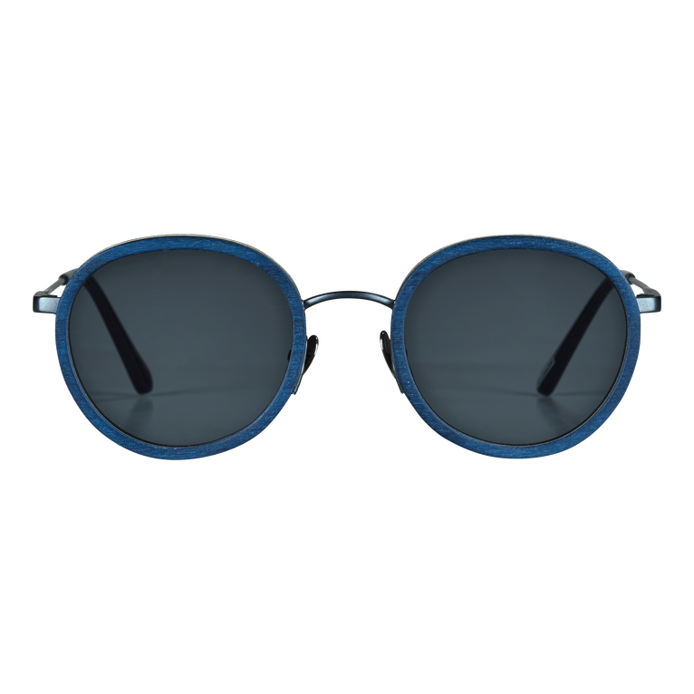 Round sunglasses featuring a blue tulipwood frame, dark lenses, and sleek metal accents, designed for both men and women, by Vilebrequin in collaboration with Shelter.