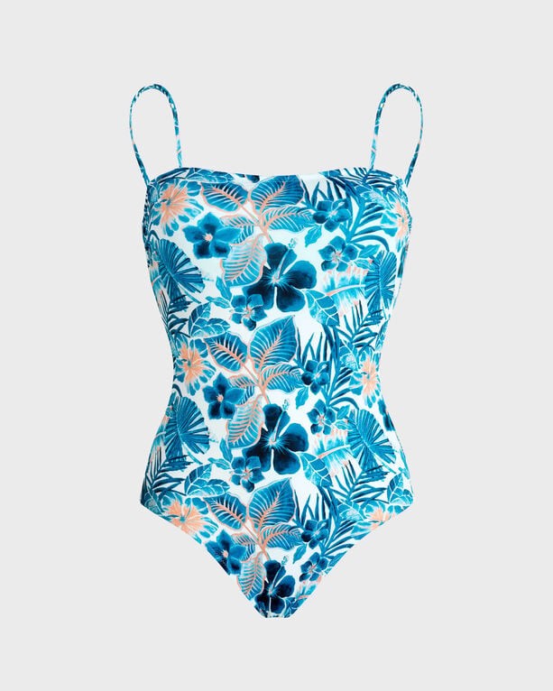 White one-piece swimsuit with a bustier style, featuring vibrant blue and pink island flower patterns, adjustable straps, and a fitted silhouette, made from stretchy swimwear material.