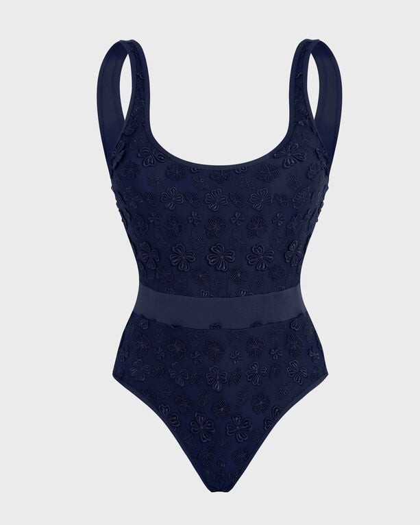 Navy blue one-piece swimsuit featuring embroidered flowers, wide shoulder straps, and a fitted waist, made from a soft, stretchy material, available in size S.