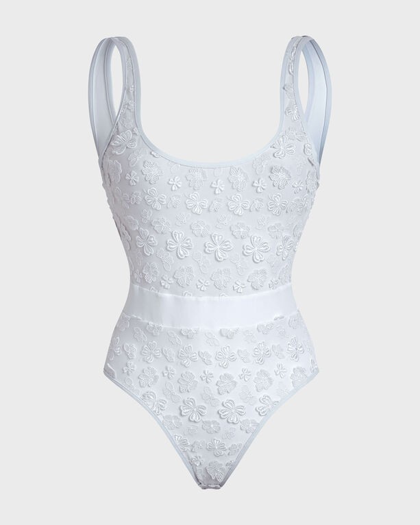 White one-piece swimsuit featuring embroidered flowers, adjustable straps, and a fitted silhouette, made from a soft, stretchy material, in size S.
