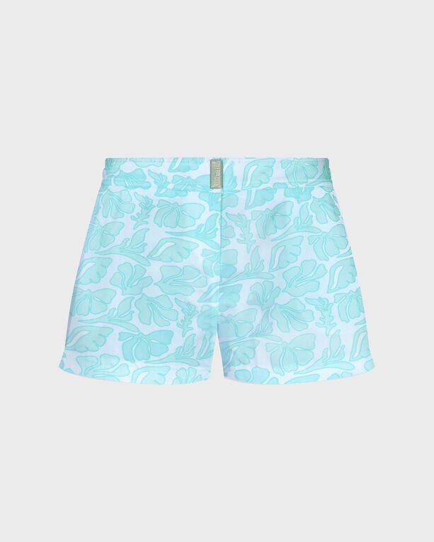 White swim shorts featuring a seashells pattern in light blue, made from stretch material, designed for women, with a shorty cut and size XS.
