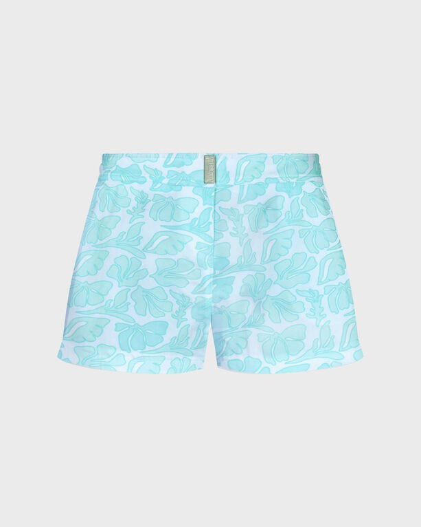 White swim shorts featuring a seashell and floral pattern in light blue, made from stretch material, with a flat belt design, labeled as size S.